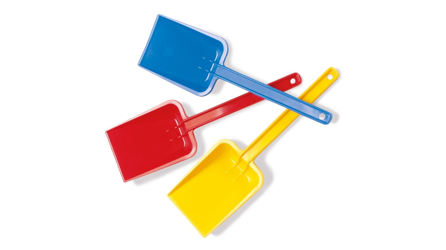 Tre sandlegeskovle i primærfarverne blå, rød og gul