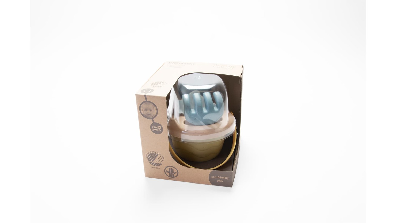Afrundet transparent og beige babylegetøj i original emballage med blå detaljer.