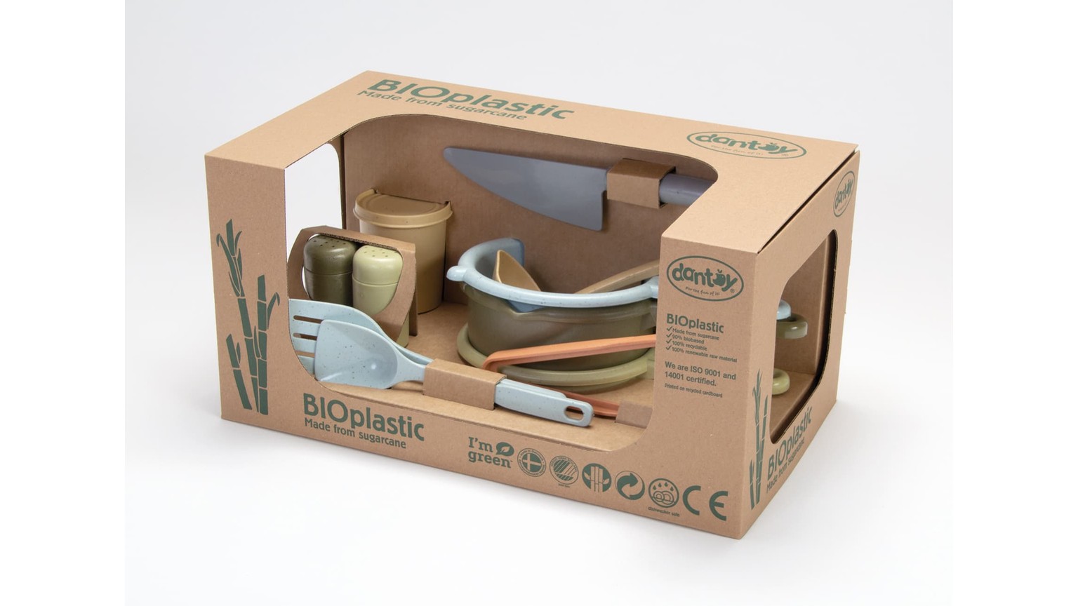 Børnelegetøj i køkkensæt med skåle og redskaber i lyseblå og beige nuancer, vist i gennemsigtig æske.